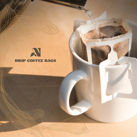 White mug with coffee filter and coffee bags, next to a box labeled 'Drip Coffee Bags'.