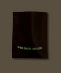 Sample Black bag of coffee titled 'GOLDEN HOUR' on a dark background