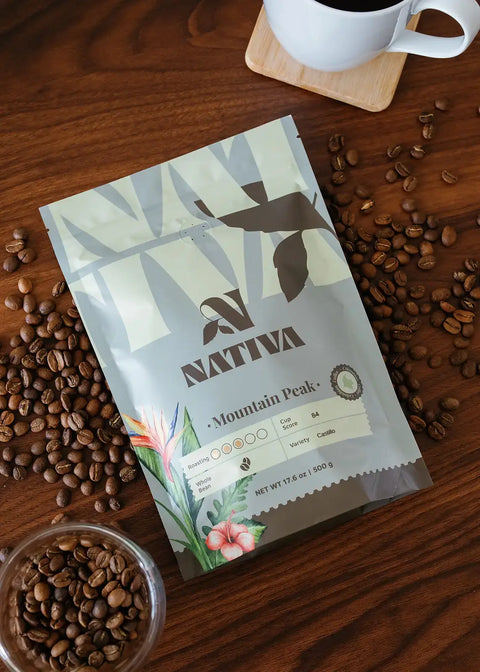 Nativa coffee package with coffee beans on a wooden surface