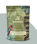 Nativa Mystic Valley coffee bag with a hummingbird illustration on a gray background