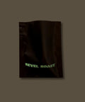 Sample black bag with 'REVEL ROAST' text on a dark background