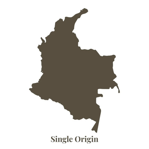 A solid dark brown silhouette of the country of colombia, labeled ’single origin’ beneath it.